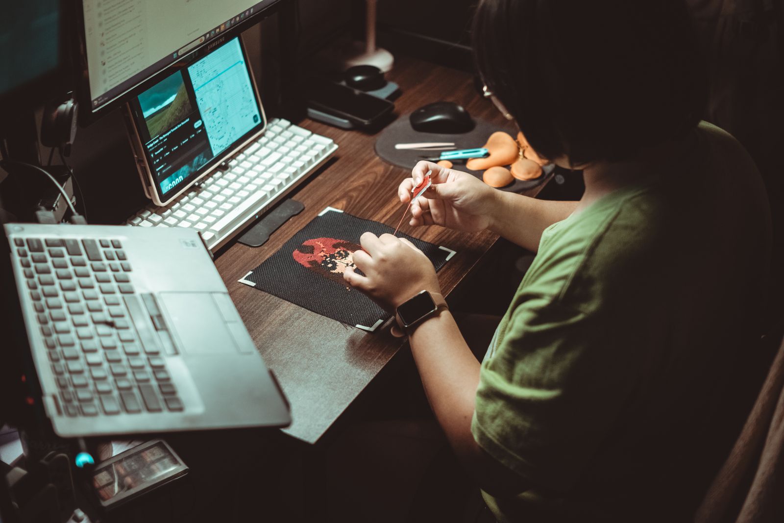 Person working on a digital embroidery design at a computer — I Can Help Sew Flowood class